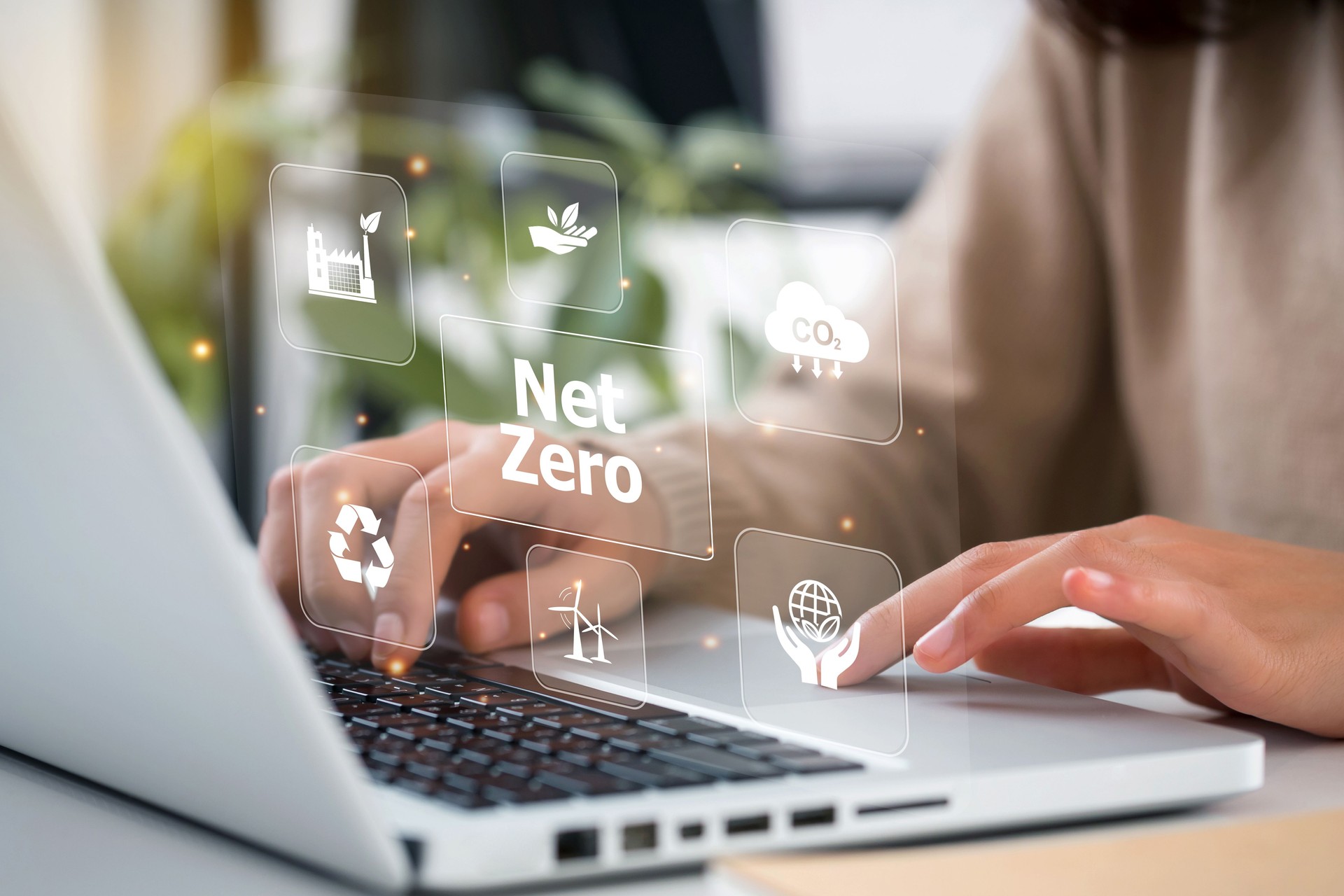 women hand using laptop for working technology and business Net zero and carbon neutral concept.NET ZERO icons and symbols save the eco world and reduce pollution. greenhouse gas emissions target.